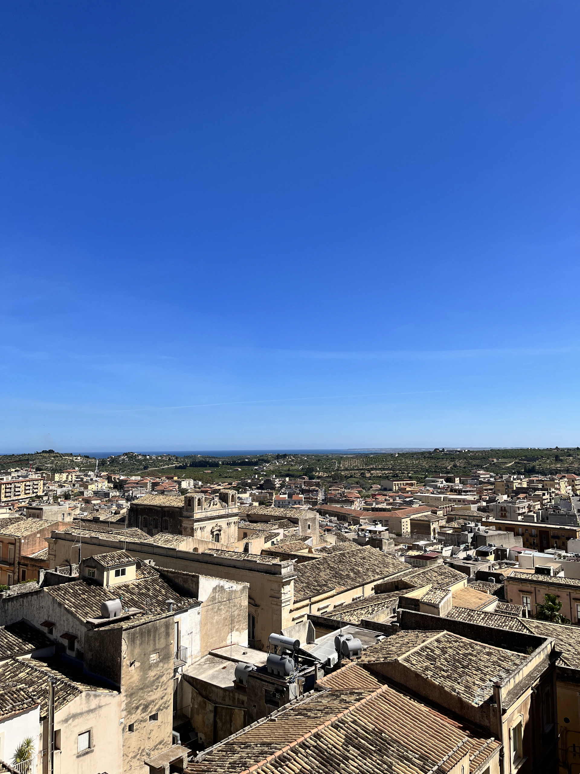woman wearing yellow long-sleeved dress under white clouds and blue sky during daytime
