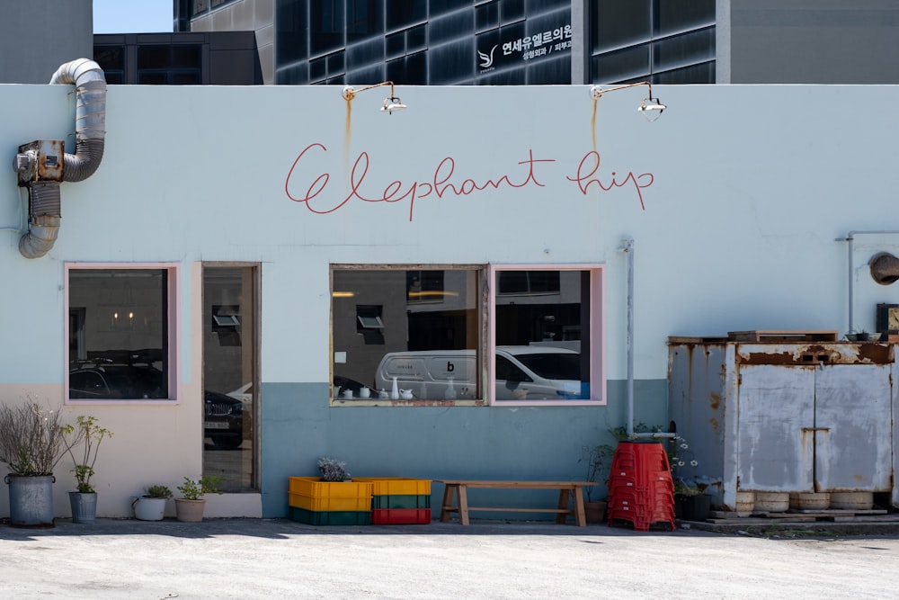 a blue building with a sign that says elephant cup