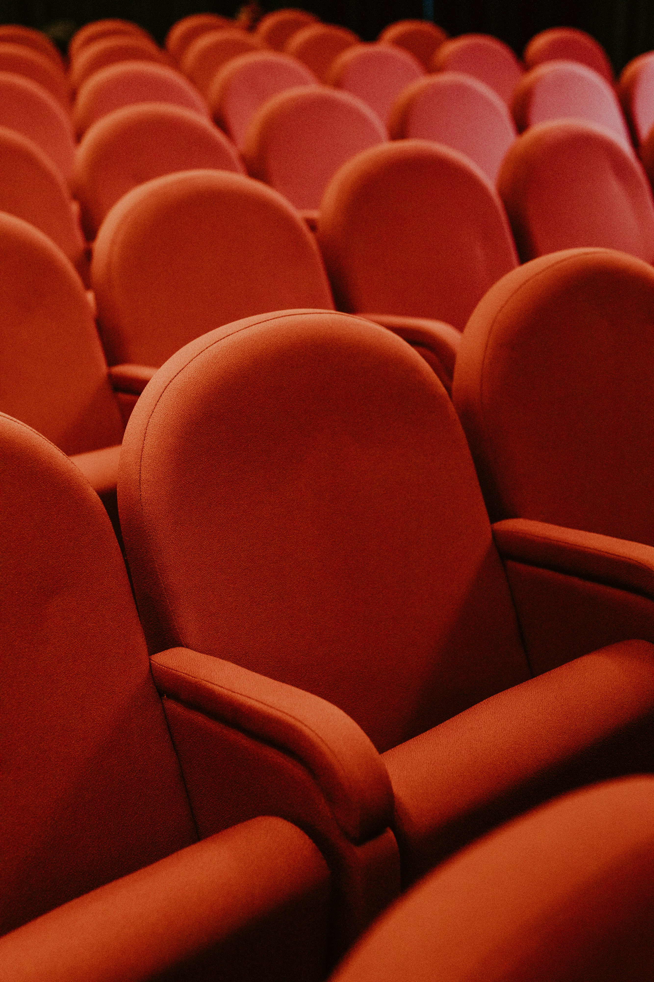 Interior of a modern, empty cinema studio with comfortable seating.