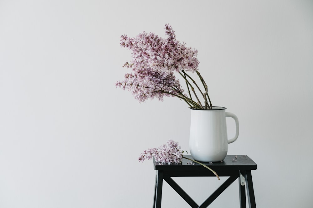 a vase with some flowers in it on a table