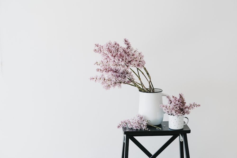 a vase of flowers sitting on top of a table