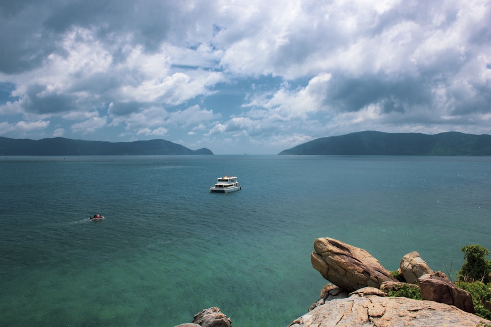 a boat floating on top of a large body of water