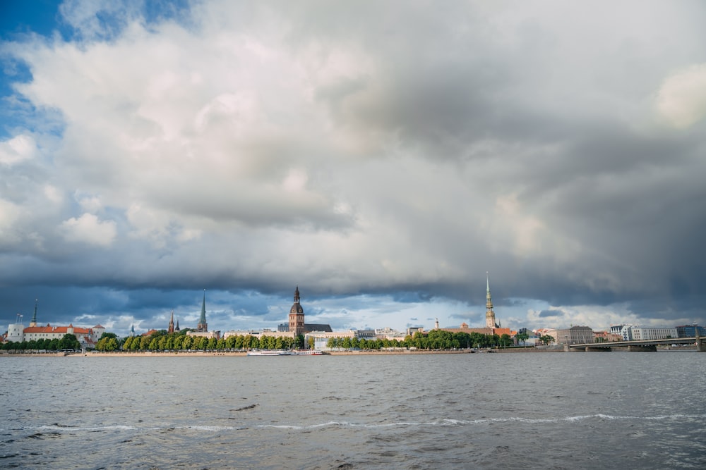 a large body of water with a city in the background