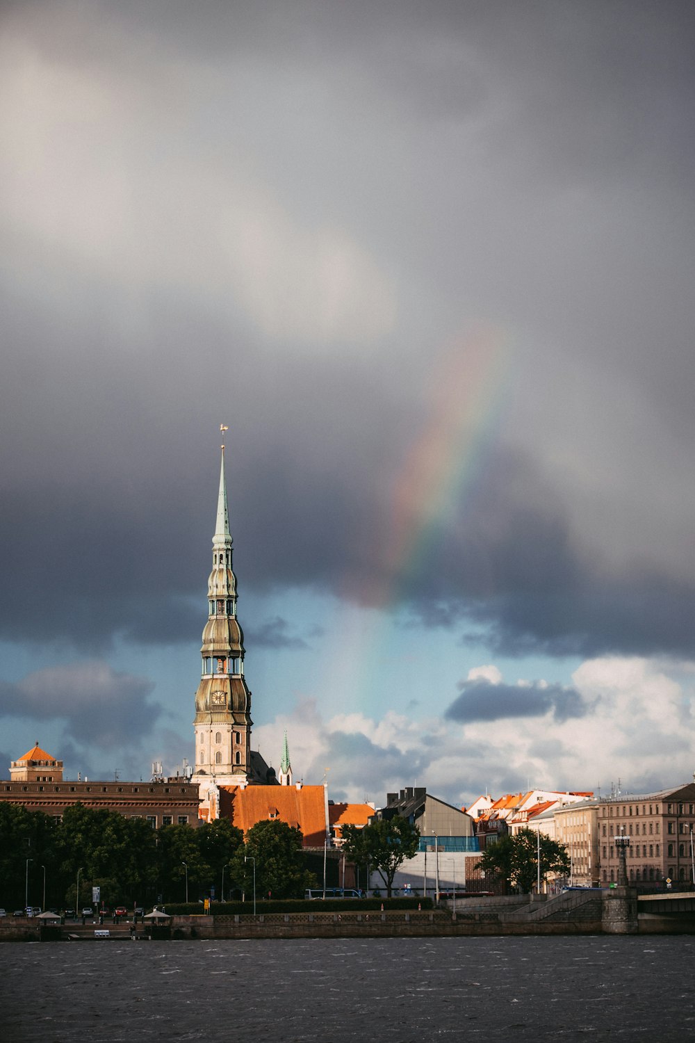 a rainbow in the sky over a city