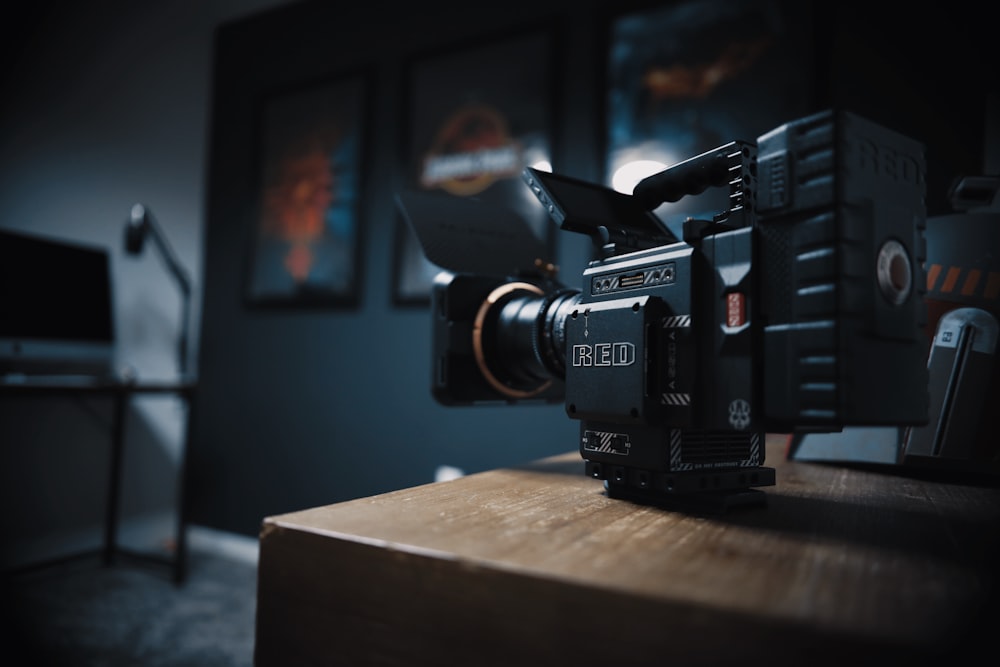 a camera sitting on top of a wooden table