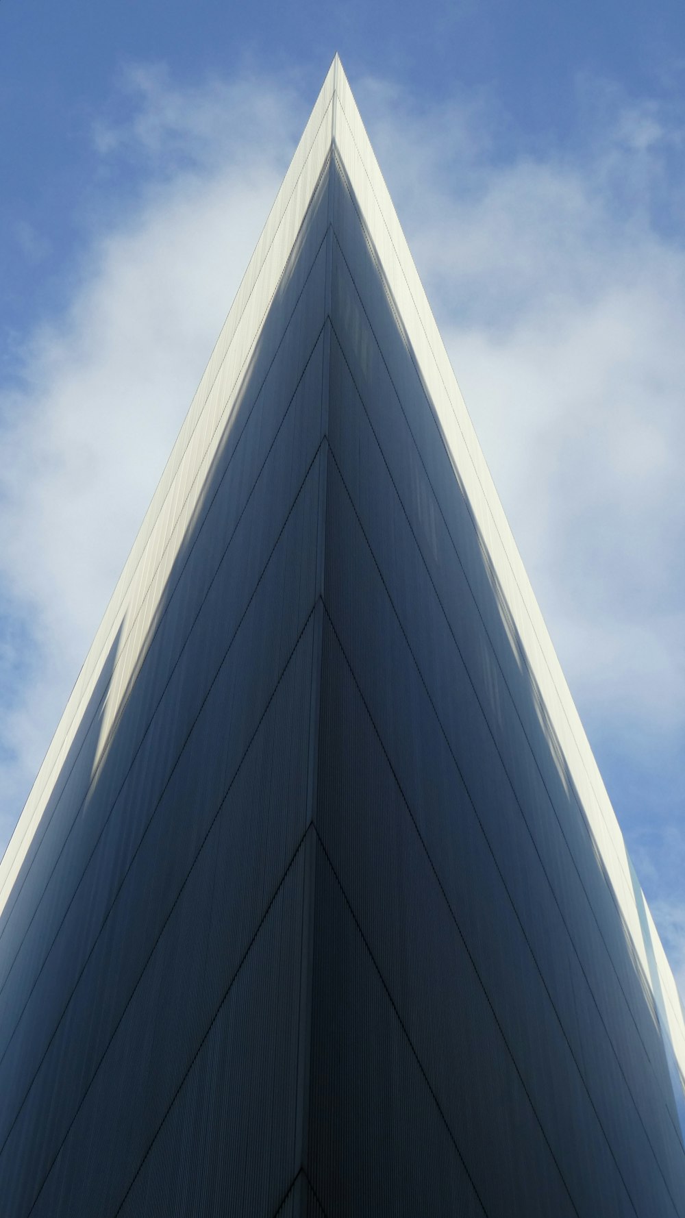 a very tall building with a sky in the background