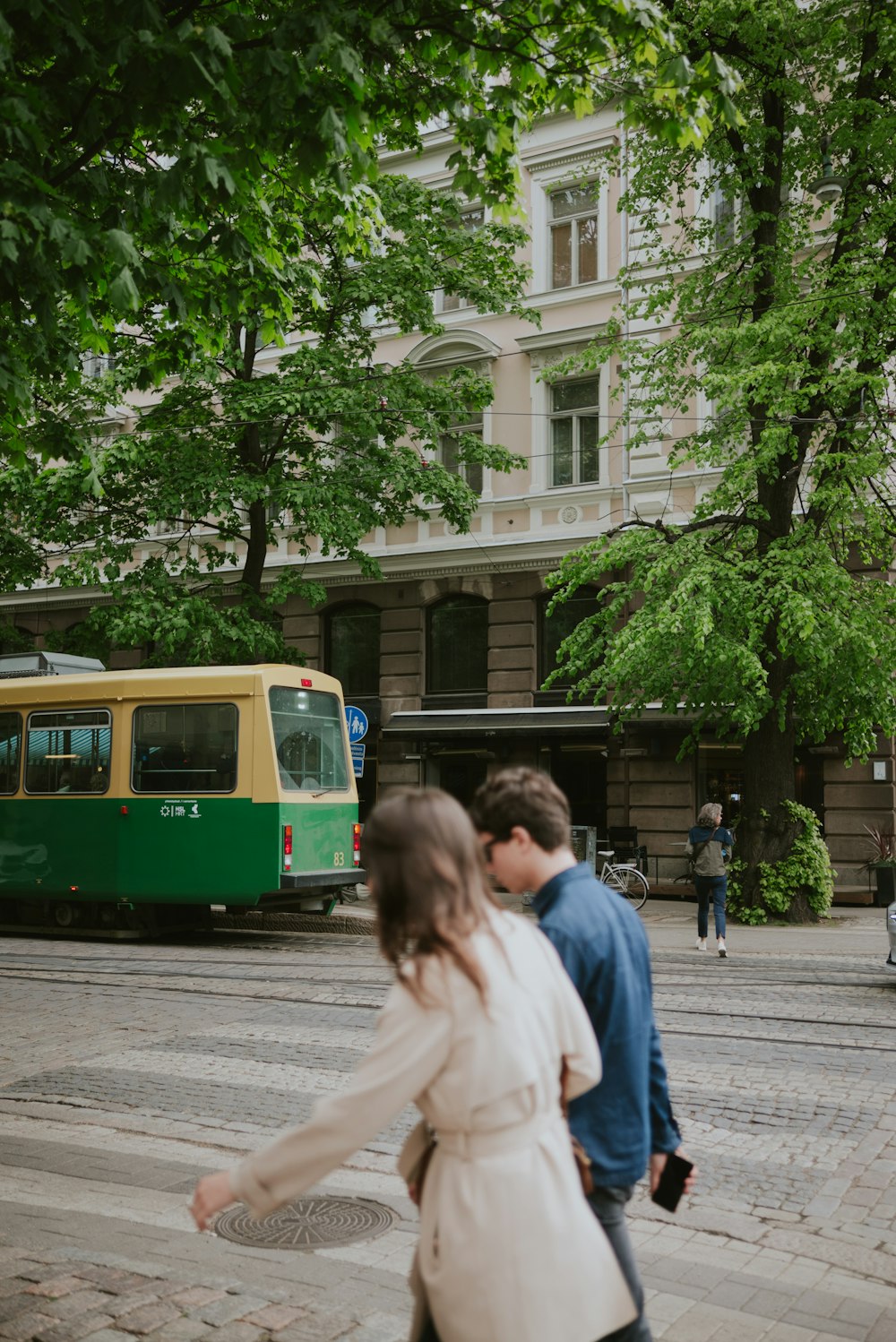 a man and a woman walking down a street