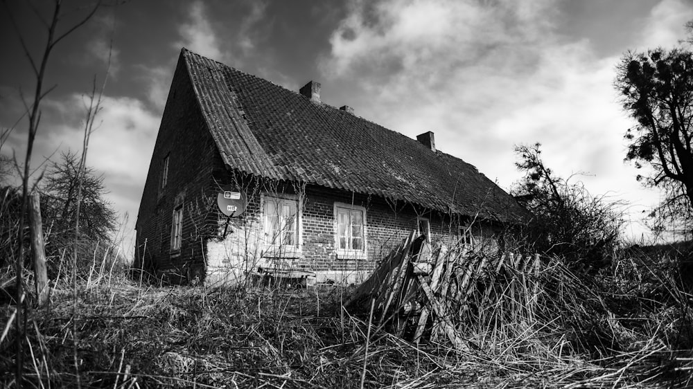 a black and white photo of an old house