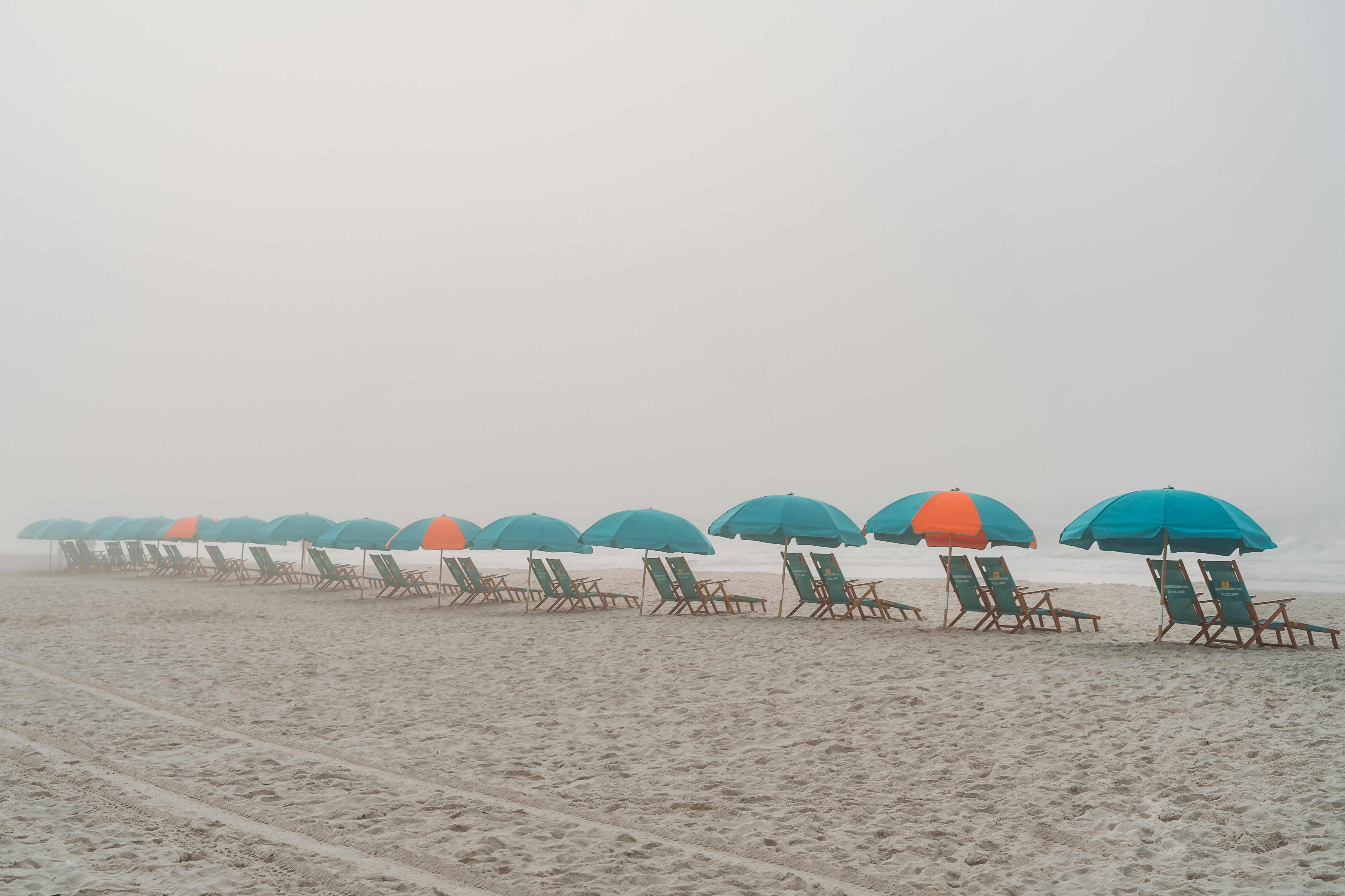 Beach Chairs in a Line on a Foggy Day