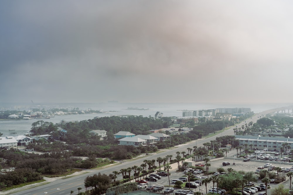 a view of a parking lot and a body of water