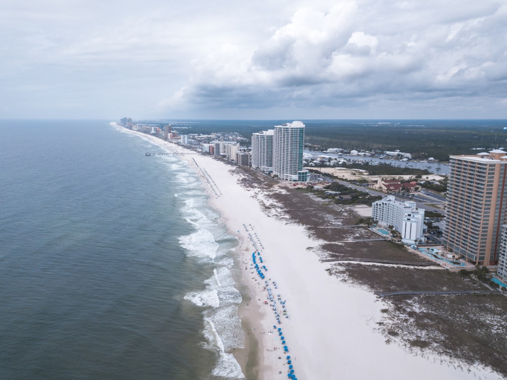 a long stretch of beach next to a city