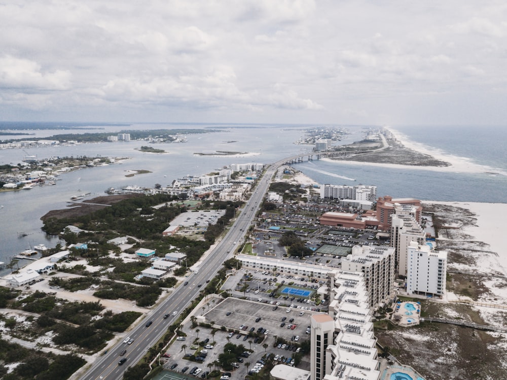 an aerial view of a city and the ocean