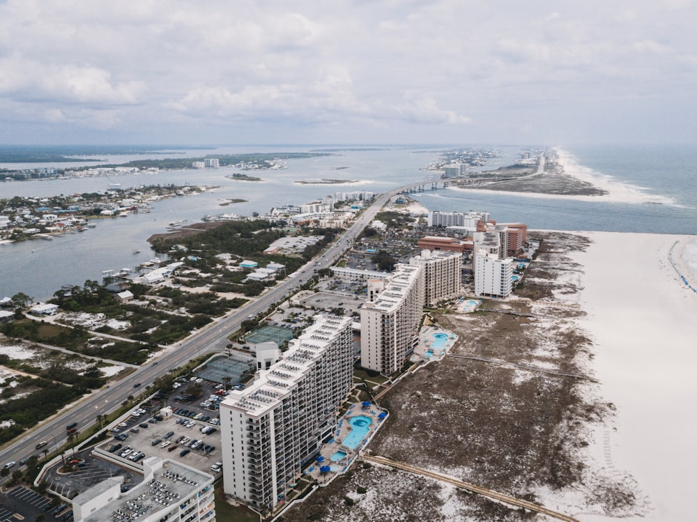 an aerial view of a beach and a city