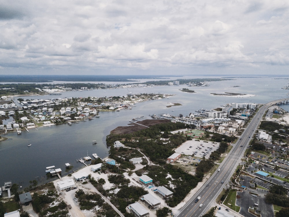 an aerial view of a city and a body of water