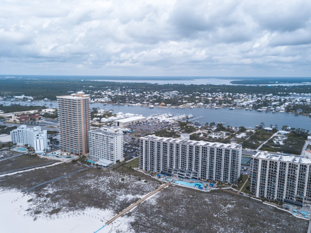 an aerial view of a city and a body of water