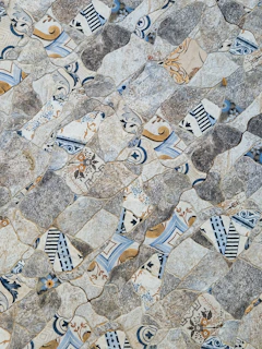 Creative mosaic detail combining various textures and colors from imported ceramics