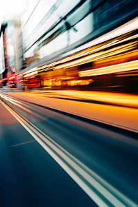 a blurry photo of a city street at night