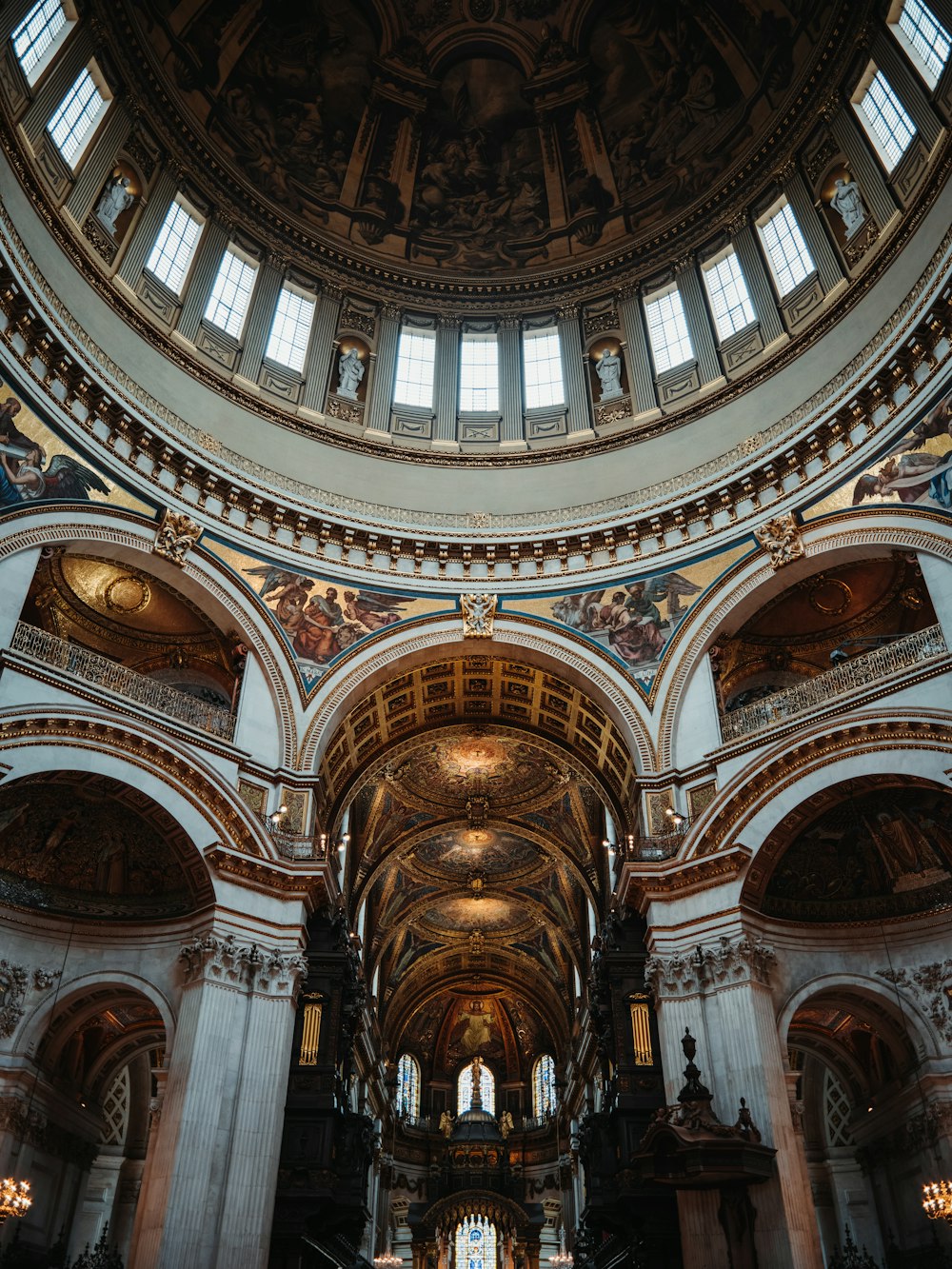 a large cathedral with a vaulted ceiling and stained glass windows