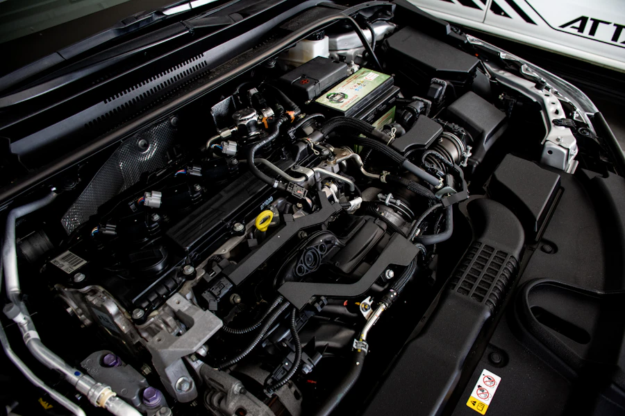 Mechanic servicing a car engine at Om Car Care garage in Ghansoli