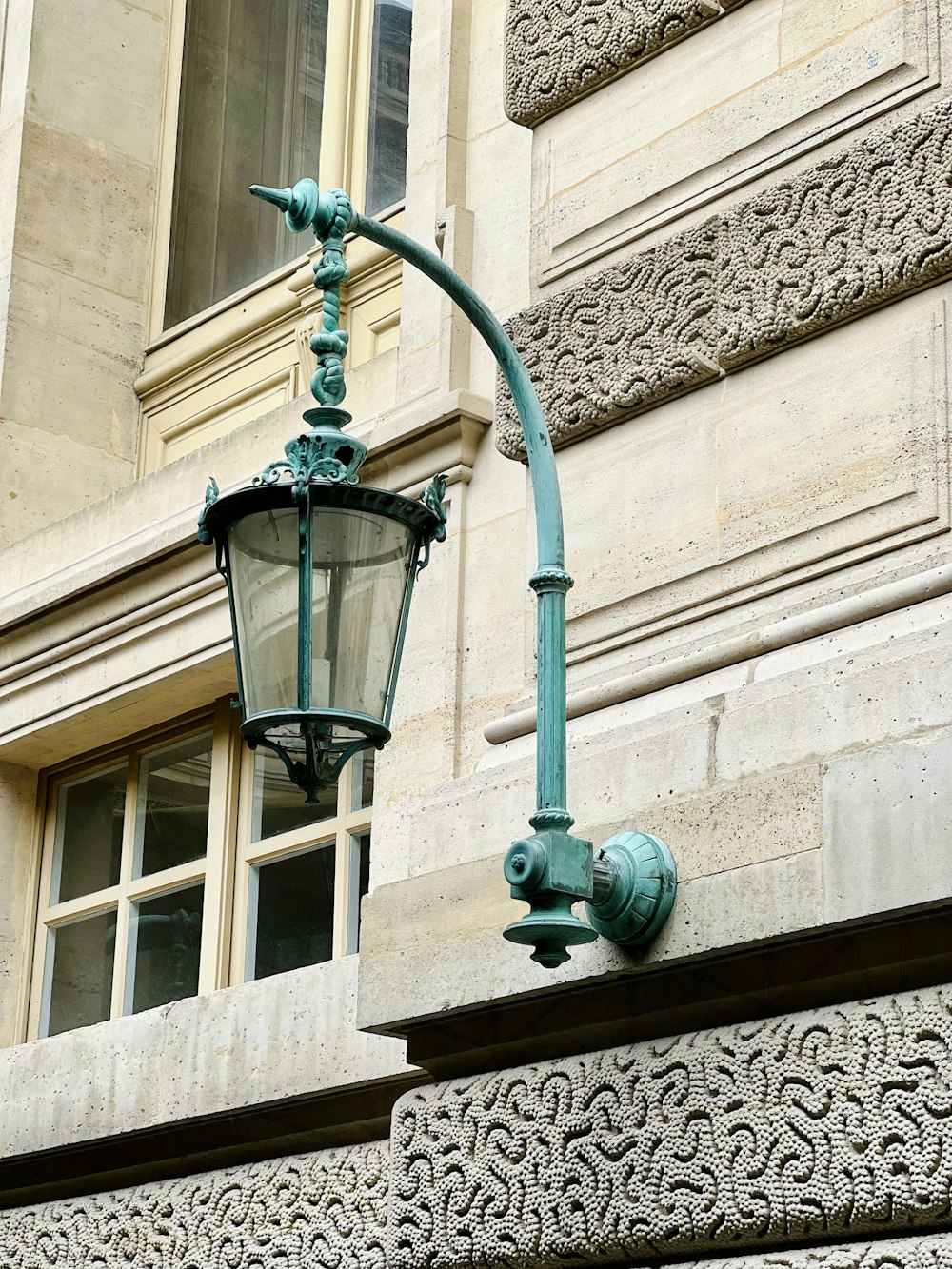a street light on the side of a building
