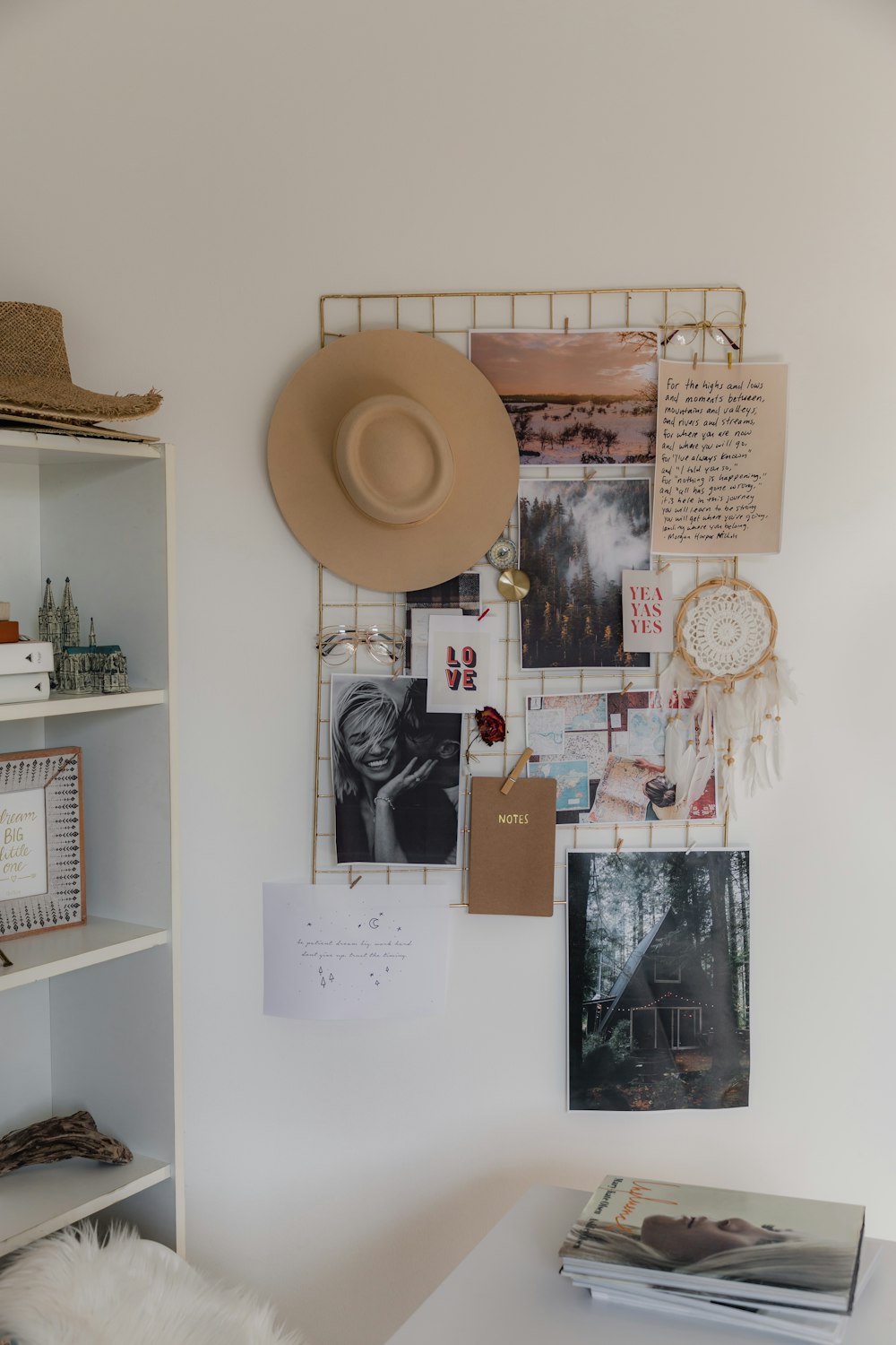 a hat is hanging on a white wall