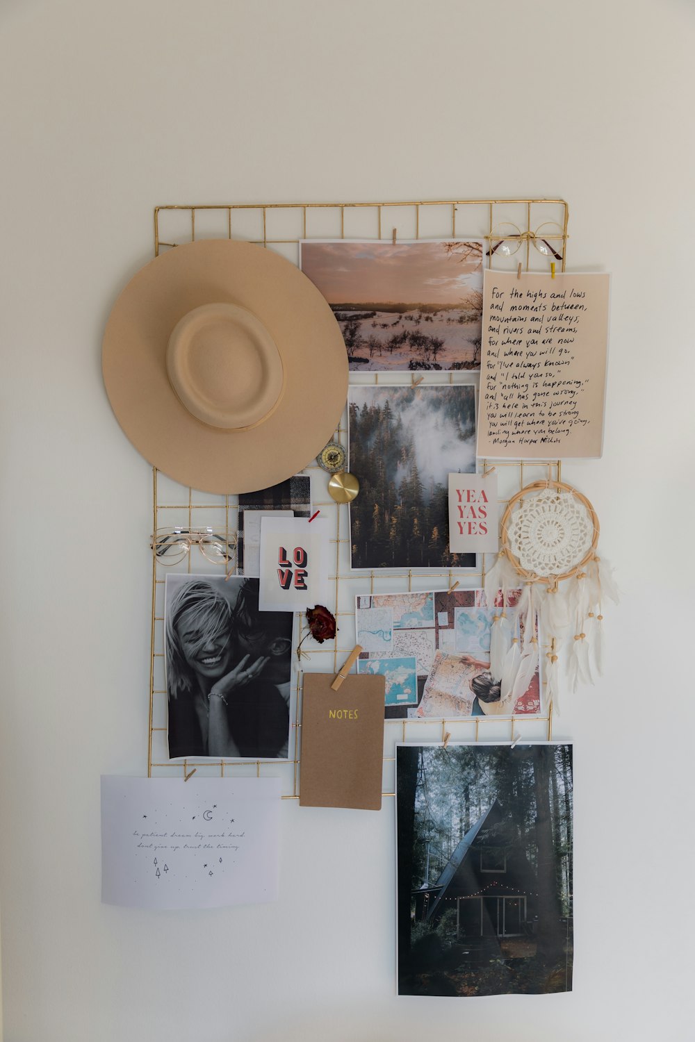 a white wall with a hat and pictures on it