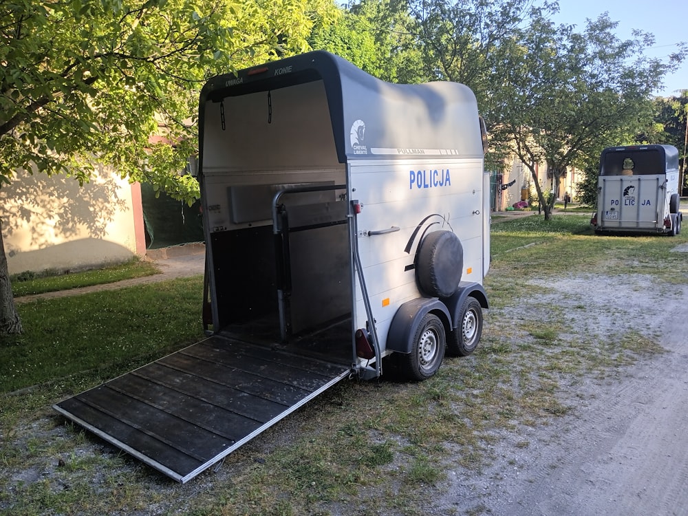 a trailer parked on the side of a road