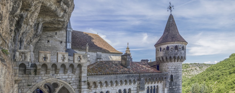 a castle with a tower and a clock on the side of it