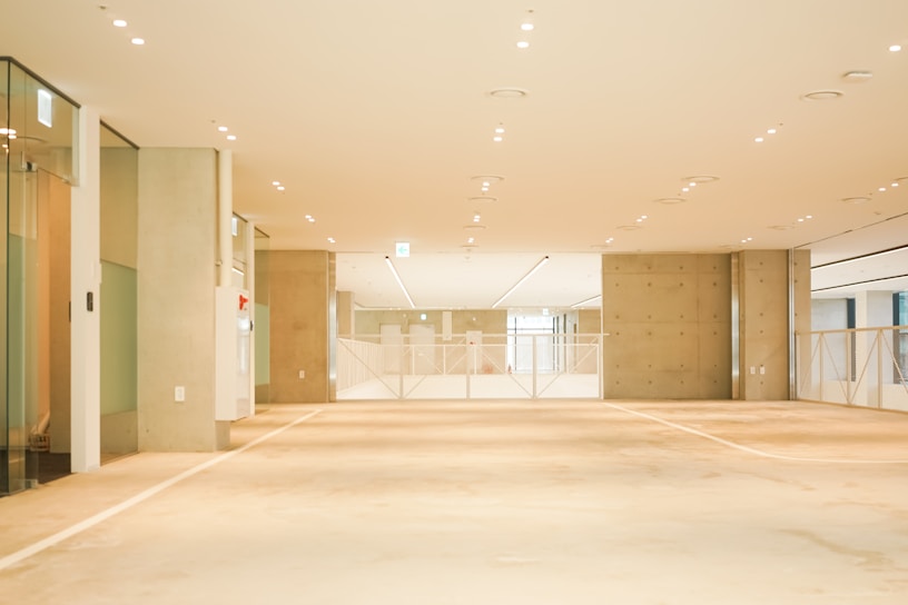 an empty room with a lot of glass doors