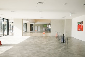 a large room with a lot of tables and chairs