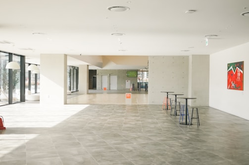 a large room with a lot of tables and chairs