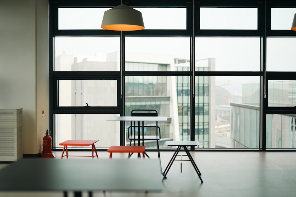 a room with a table, chairs, and a fire hydrant