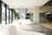 Modern interior space showcasing sleek furniture and warm lighting in an open office environment.