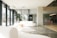 Modern interior space showcasing sleek furniture and warm lighting in an open office environment.