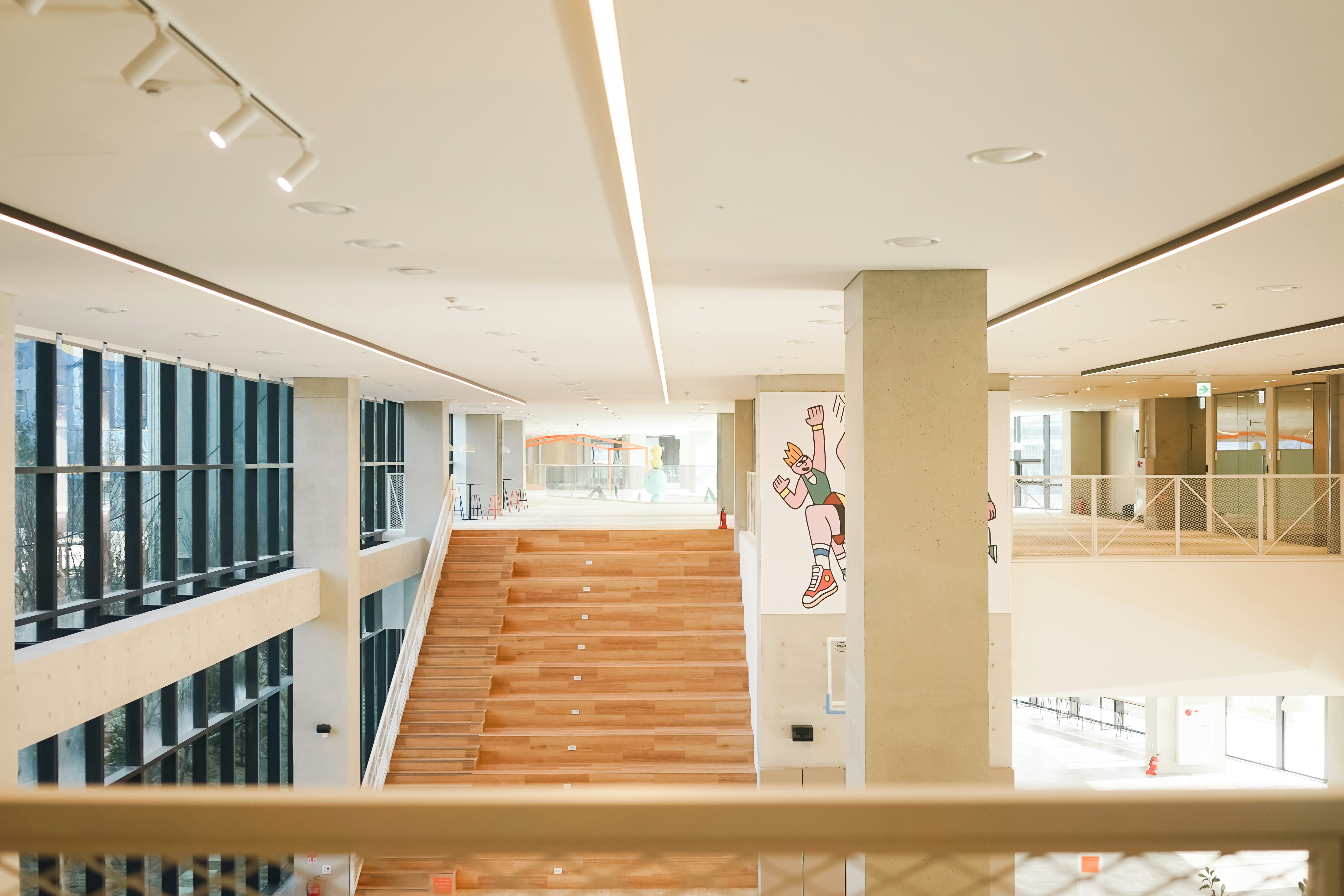 a view of a staircase from the second floor of a building