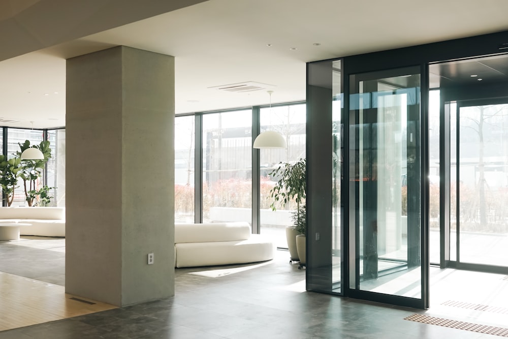 a living room with a lot of glass doors