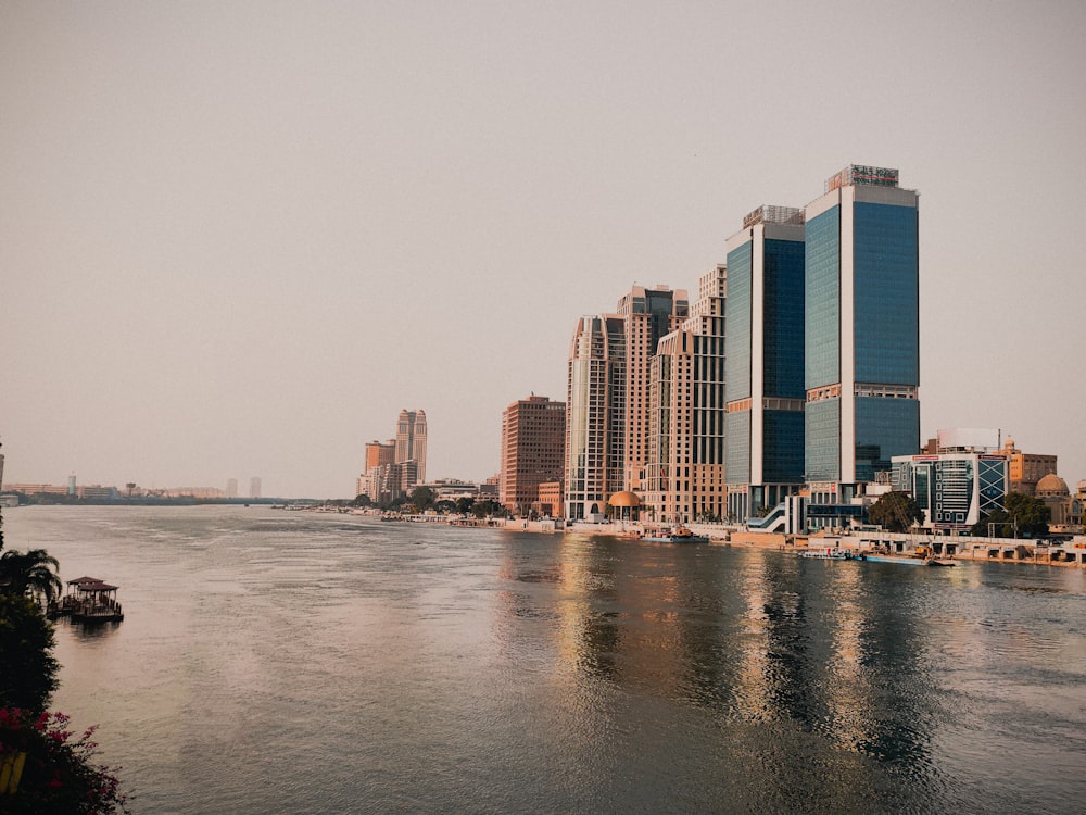 a body of water with a city in the background