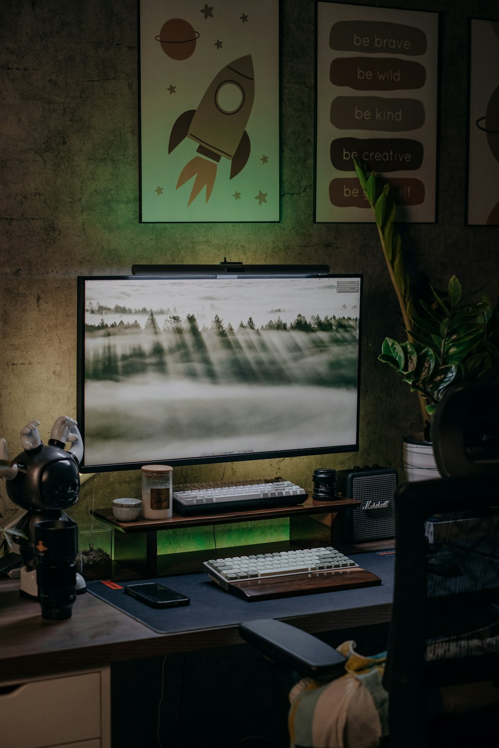 a computer desk with a monitor and keyboard