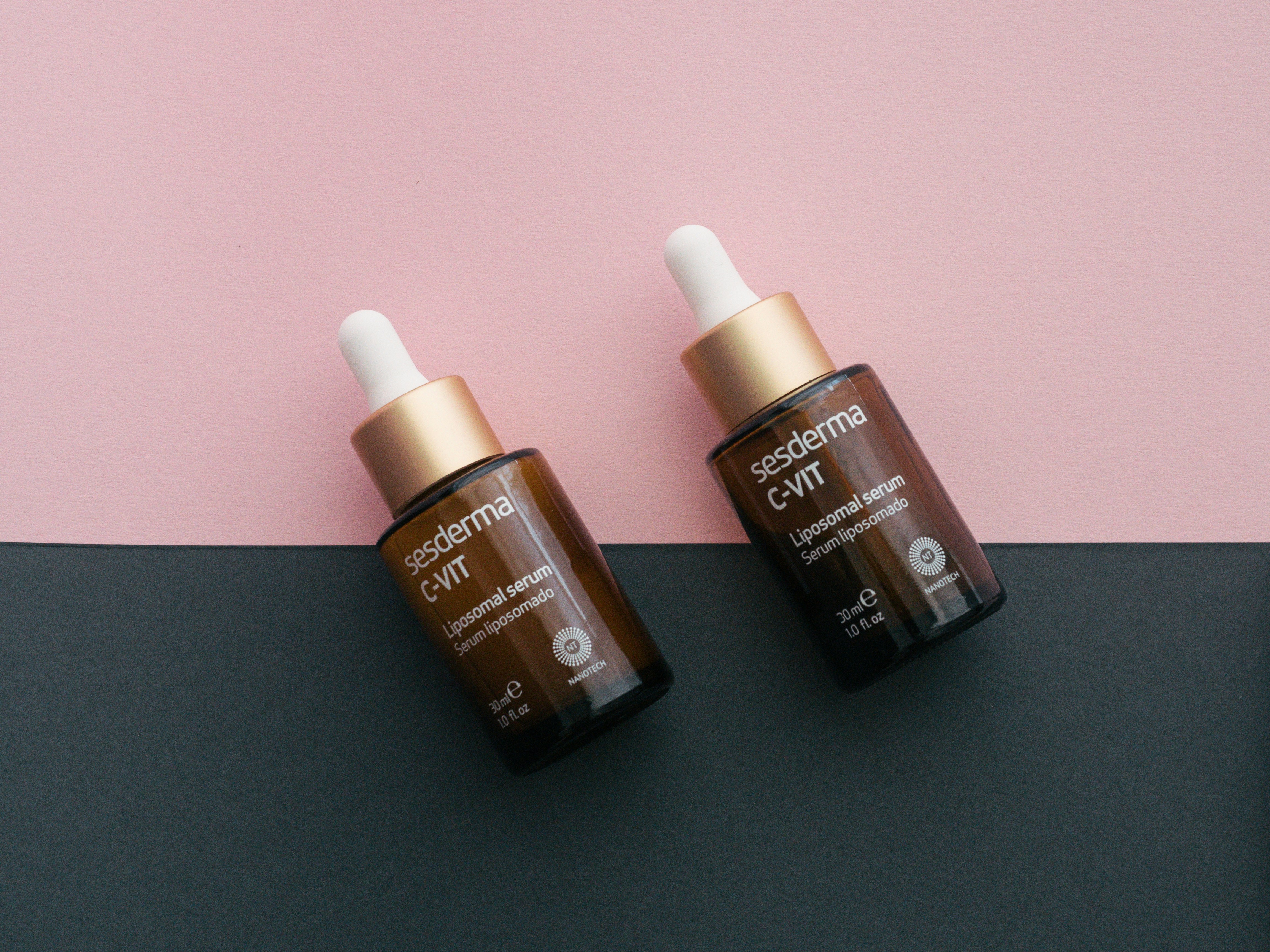 Two identical skincare bottles