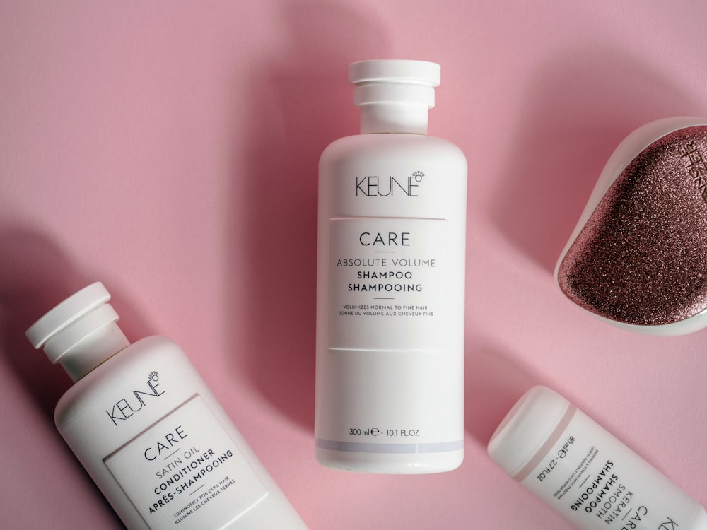 a bottle of keune care next to some other products