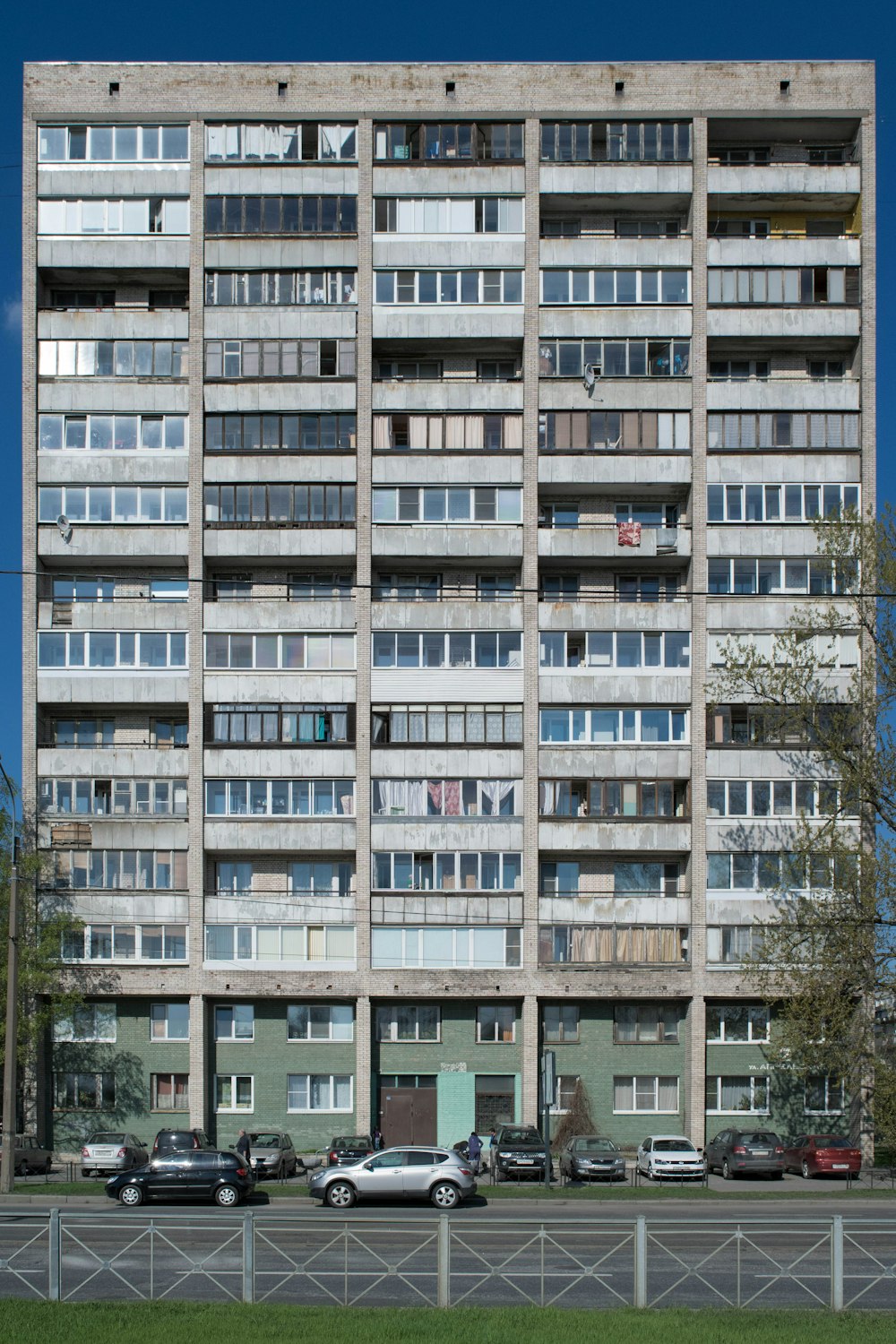 a very tall building with lots of windows and balconies