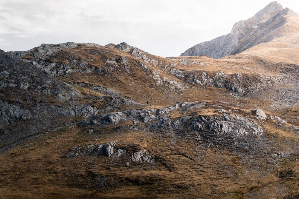 a mountain with a few rocks on the side of it