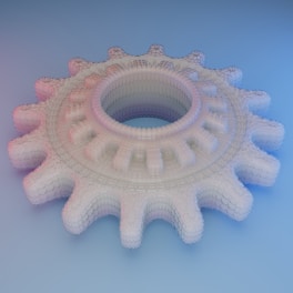 a 3d model of a gear wheel on a blue background