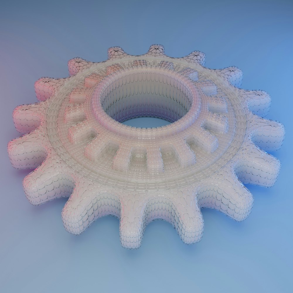 a 3d model of a gear wheel on a blue background