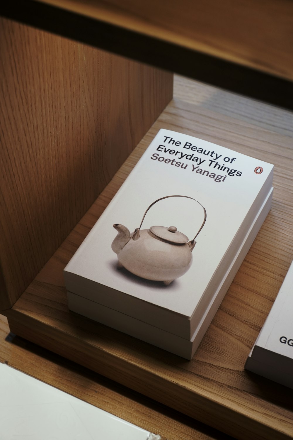 a couple of books sitting on top of a wooden table