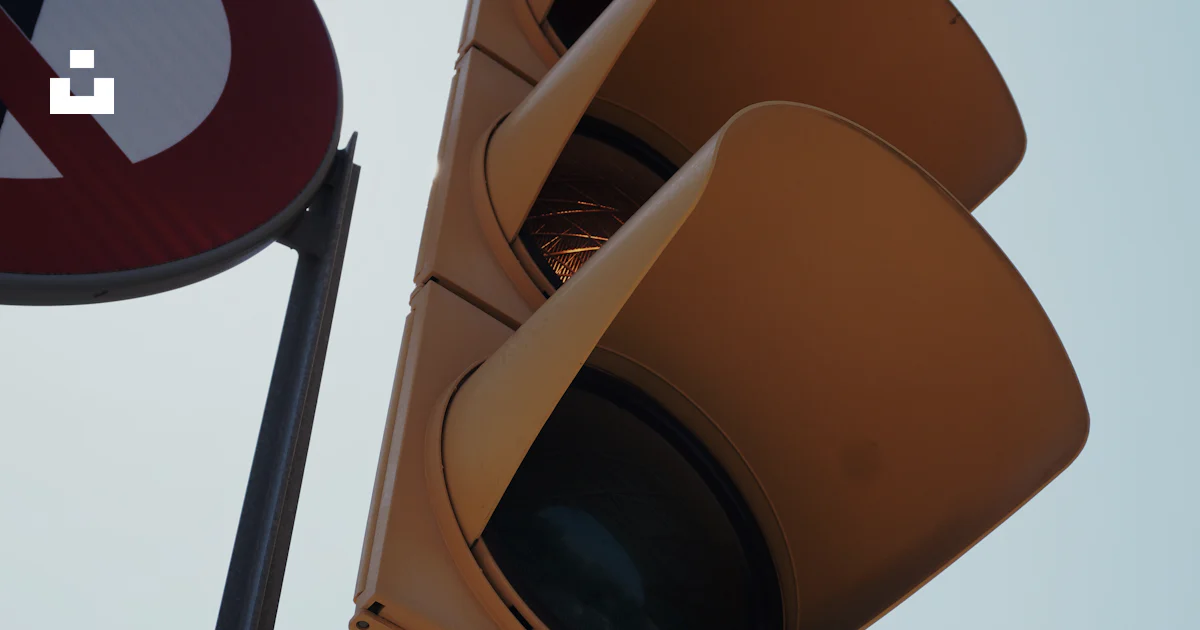 Nlt Sign A traffic light with a no left turn sign next to it photo – Free Yellow ...