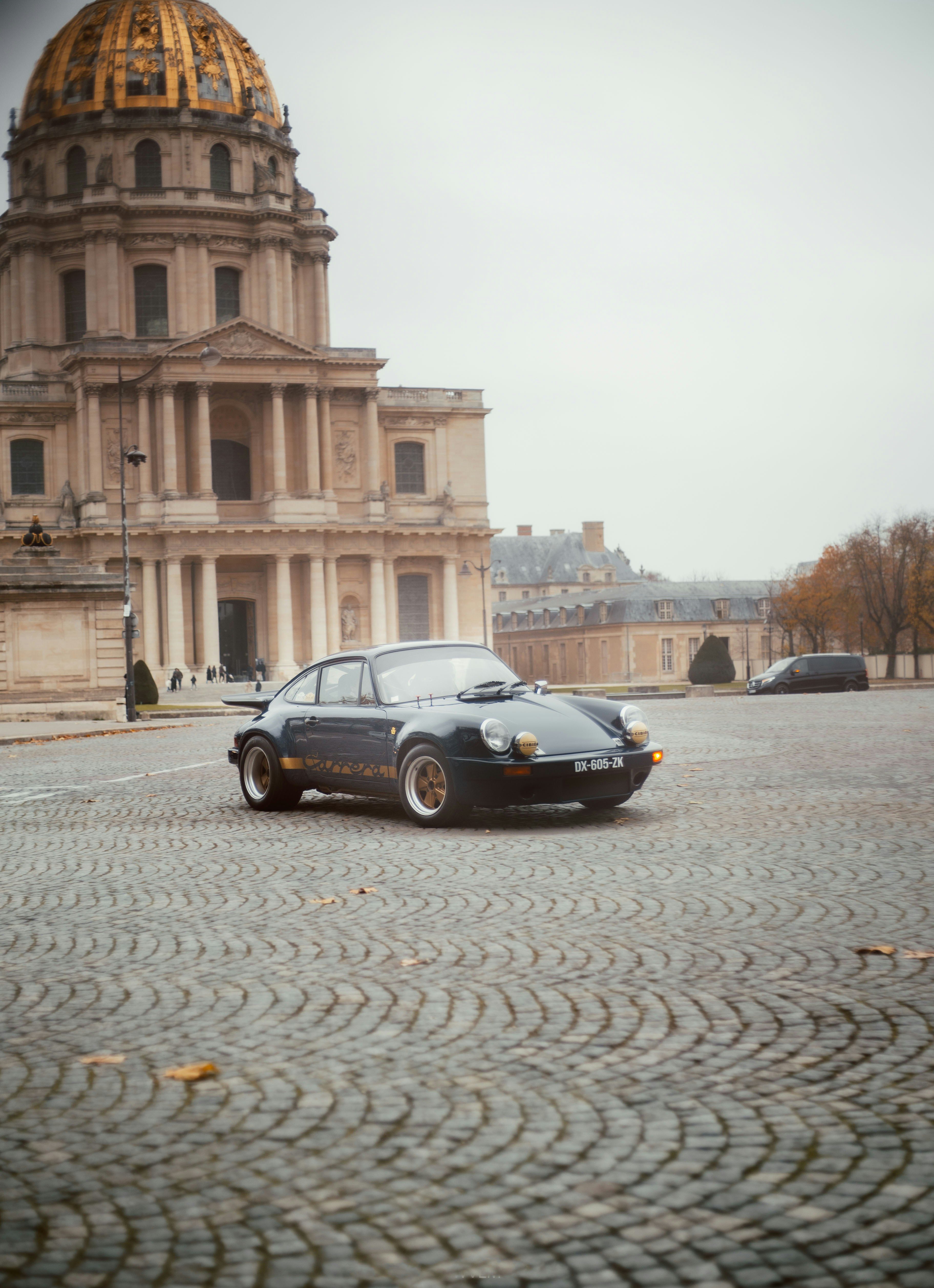 a black car parked in front of a building