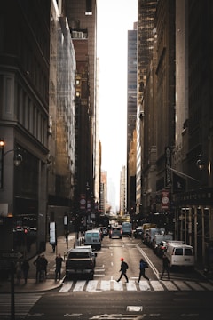 A cinematic shot of a bustling city street at golden hour with dynamic framing