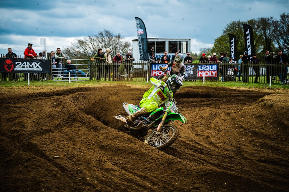 a person riding a dirt bike on a dirt track