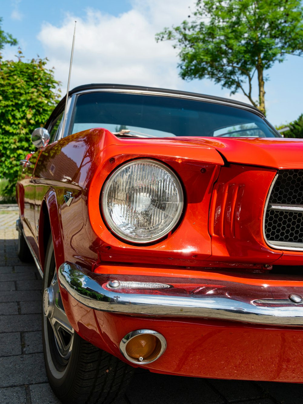 a red car parked on the side of the road